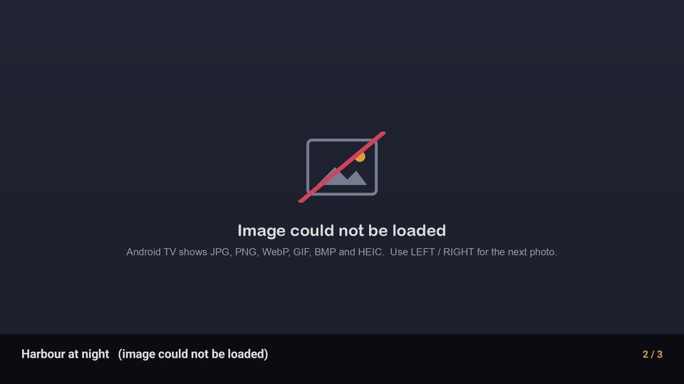A placeholder card reading "Image could not be loaded" in the middle of the screen, with a line underneath naming the photo formats the app can show, and the caption bar saying the photo's title followed by "(image could not be loaded)" at position 2 of 3.